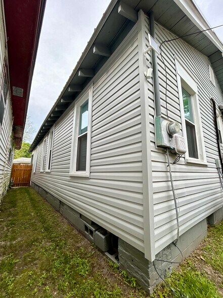 Side View Fenced Entrance/Exit - 1003 W 46th St