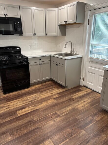 Updated kitchen, subway tile backsplash - 721 E Clinton St