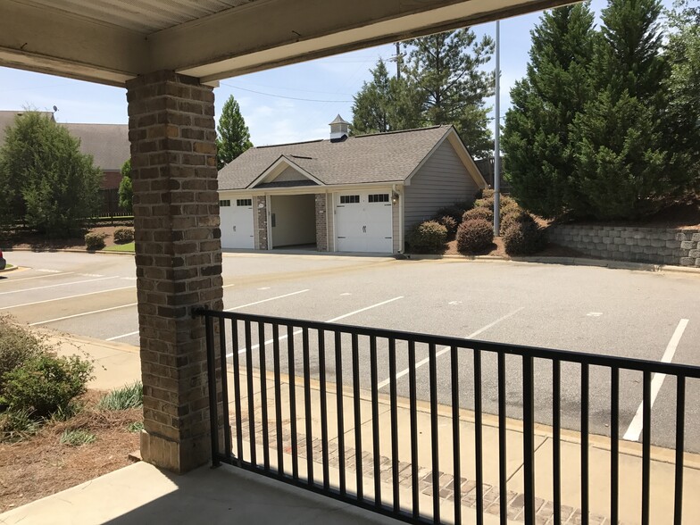 view from patio to your dedicated garage space and 2 parking spaces at patio - 1931 Dante Ln