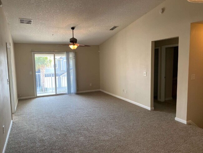 Building Photo - Beautifully Updated & Spacious 3BR/2BA Condo in a Secure Gated Community — Includes Cable, Intern...