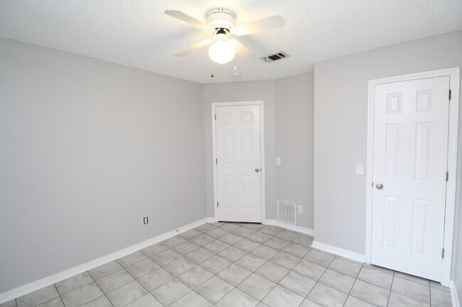 Building Photo - West Pensacola Brick Home with Vaulted Ceilings, Split Floor Plan, Open Living Design & Easy Acce...