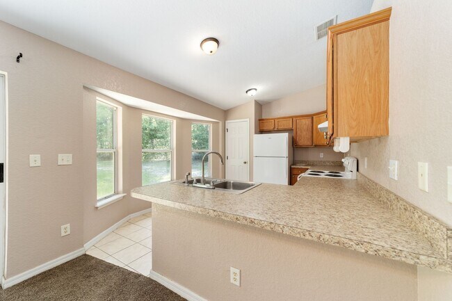 Building Photo - Peaceful 3-Bedroom Home with Open Floor Plan & Two-Car Garage in Rainbow Lakes Estates!