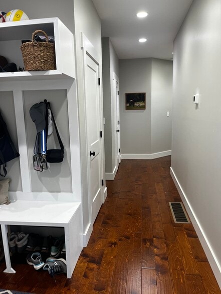 Garage entryway and guest hallway - 100 N Homestead Ln