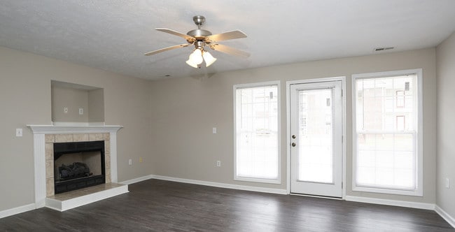 Enjoy plank style flooring and a warm fireplace at your new home - Karen Lake Apartments