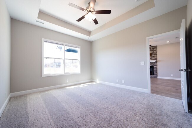 Building Photo - Elegant Home with Stone Fireplace, Kitchen Island and Designer Primary Suite