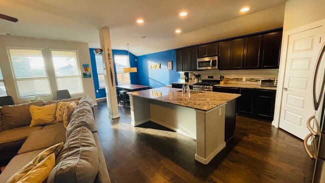Open kitchen with Stainless Steel appliances - 7108 Garnet Mill Ln