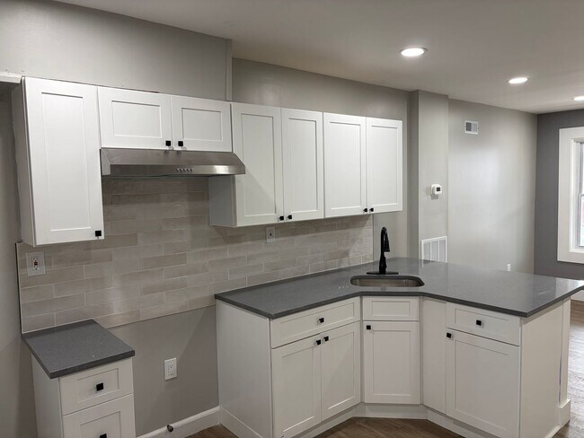 Building Photo - Newly Renovated 2- Story Townhome with Front Porch and Back Yard