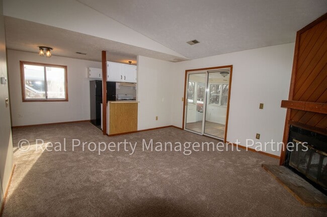 Building Photo - 2-Bed, 1-Bath Upper Unit with Garage & Porch – Steps from Paul Henry Trail