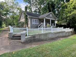 Building Photo - Introducing WesleyHeights401, a charming 3...