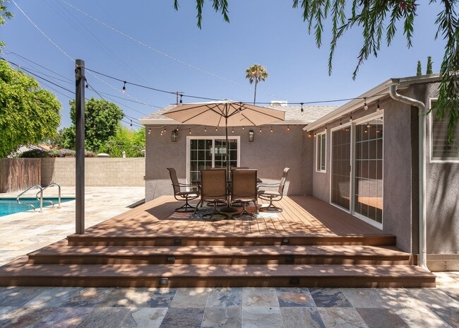 Building Photo - *Unfurnished* Gorgeous 4-Bed Oasis with Po...