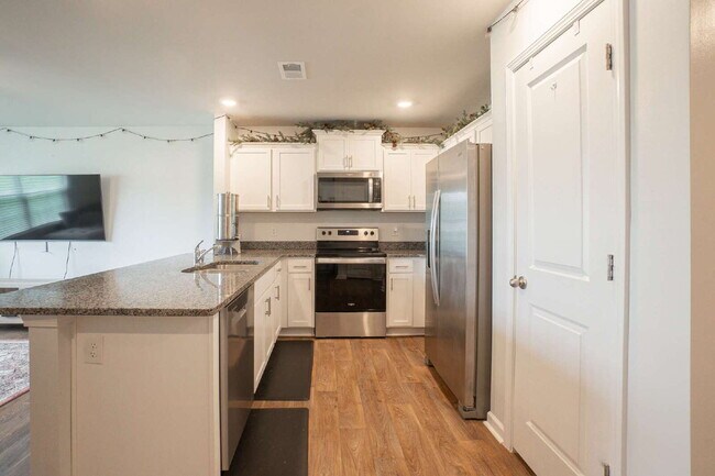 Building Photo - Partially furnished and now available!