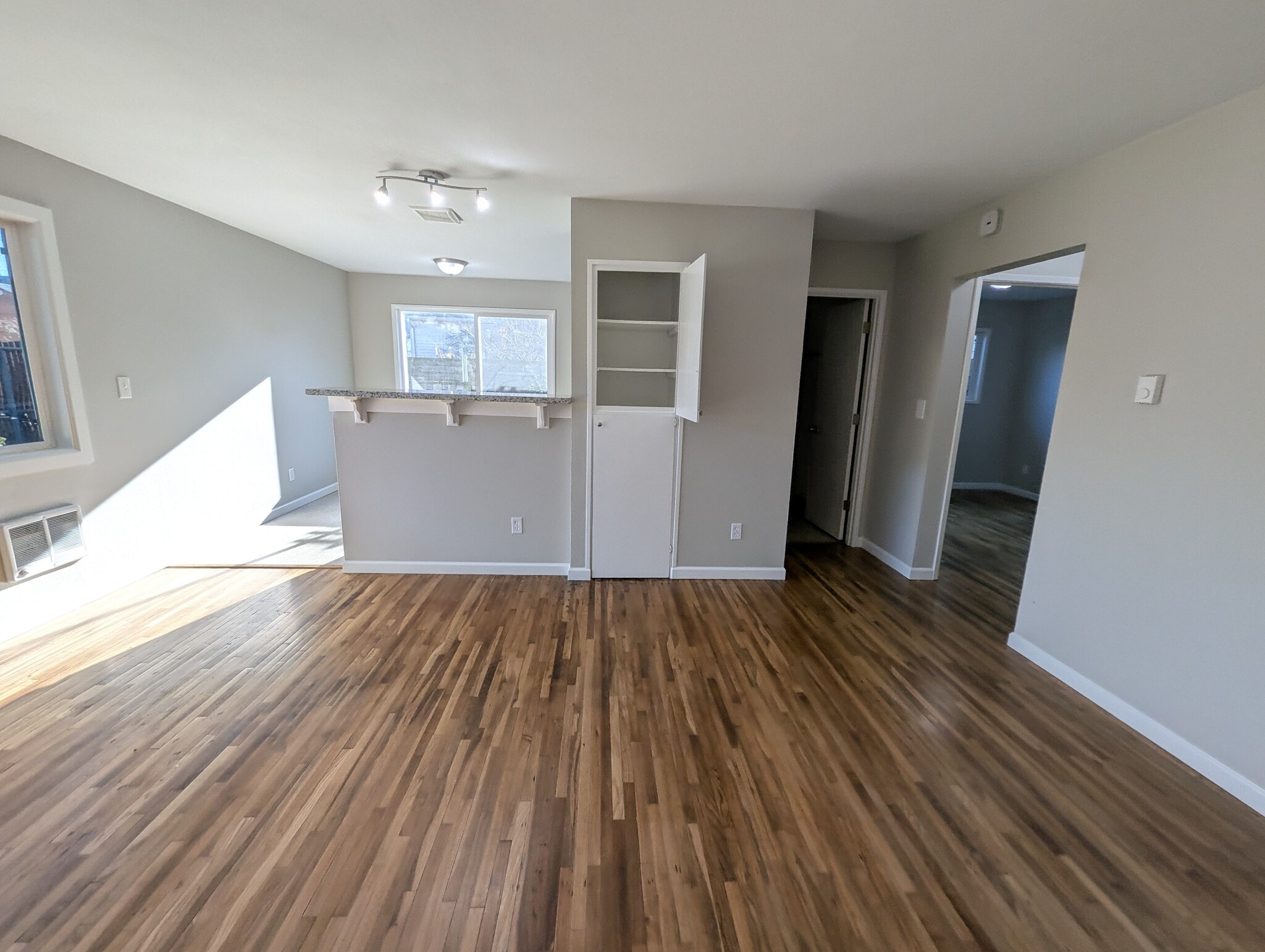 Eating counter bar separates kitchen and living room - 1626 Southeast Lexington Street