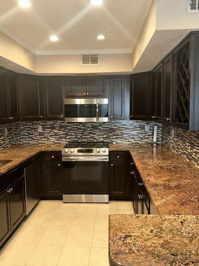 Building Photo - THE TRIAD TOWNHOMES IN CARROLLWOOD