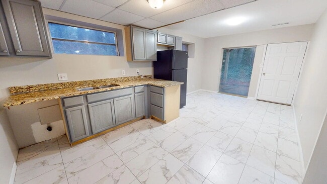 Building Photo - THE UNION GROVE | Gorgeous renovated home in Lithonia featuring large common areas, a spacious ki...