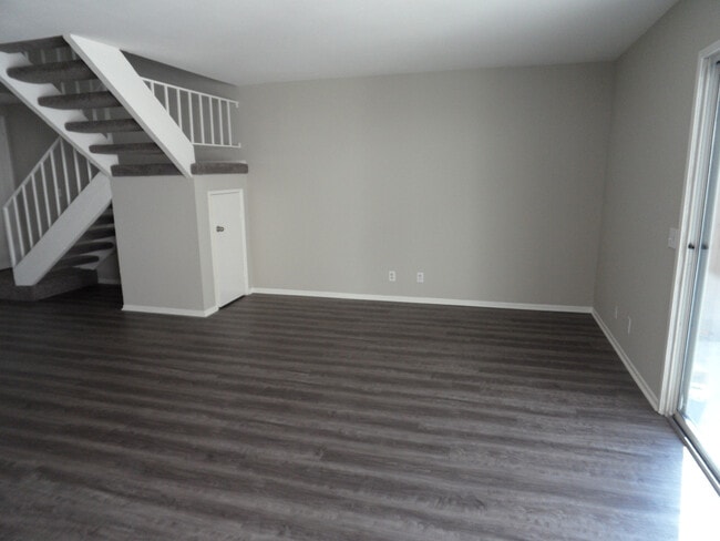 Building Photo - Two Story 4 BR 2.5 BA Condo With 2 Car Garage