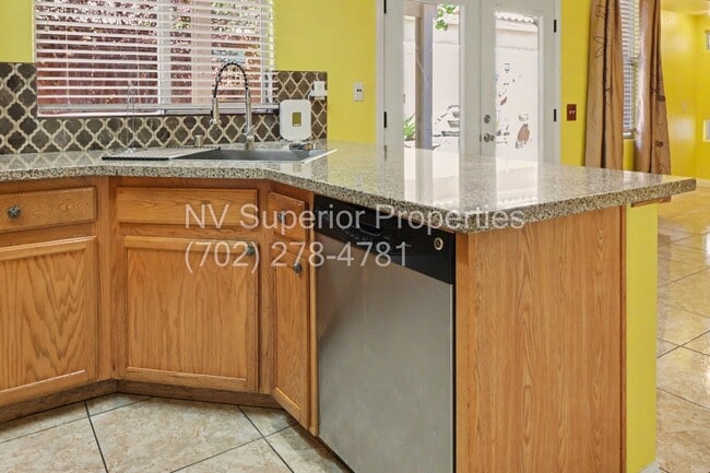 Building Photo - NW!! 4 Bedrooms!!! All Tile and Pergo flooring T/O!! NO Carpet!!! Low Maintenance Desert landscap...