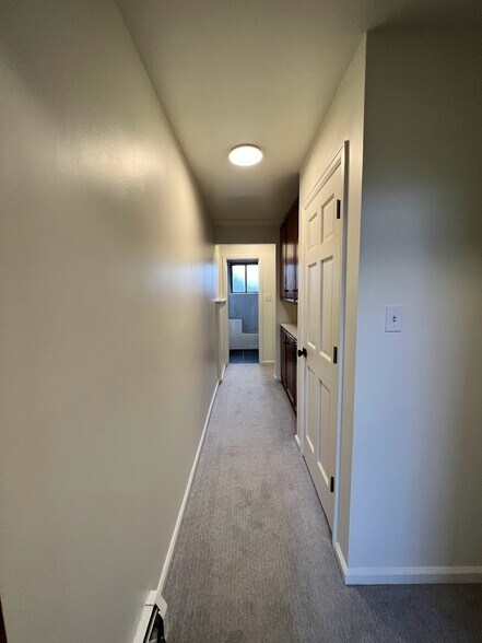 Downstairs hallway to bedrooms & bath - 6215 S Sterne Pky