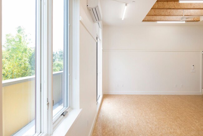 Building Photo - Bright Live-Work Studio with Deck & Tall Ceilings off Lowell Street in Oakland