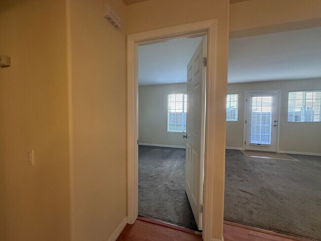 Building Photo - Upgraded Condo with Private Patio, AC, Pool, Gym, and Covered Parking in Gated Community