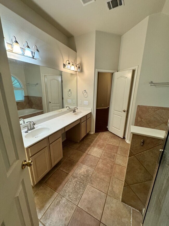 Building Photo - Ready For Move In! A Must See in Rogers Ranch - 4 Bedroom 2 Bath with Custom Features