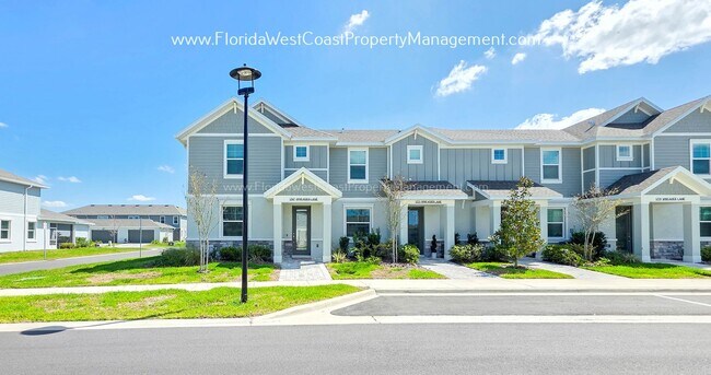 Building Photo - EXCEPTIONAL AND SPACIOUS FURNISHED TOWNHOME WITHIN WATERSIDE- NAUTIQUE!