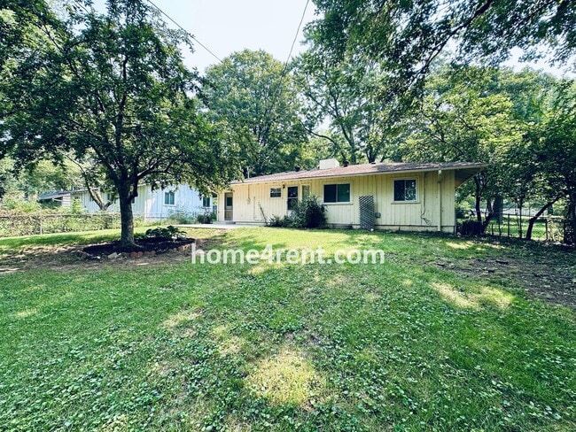 Building Photo - Attractive Prairie Village Ranch w/ FRESH PAINT, Wood Floors, Granite Counters and a Fenced Yard!