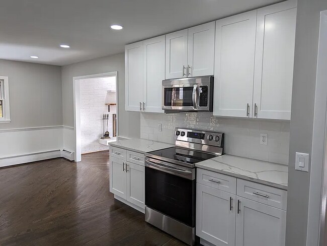 Building Photo - this contemporary & brightly remodeled 2,400 sqft home