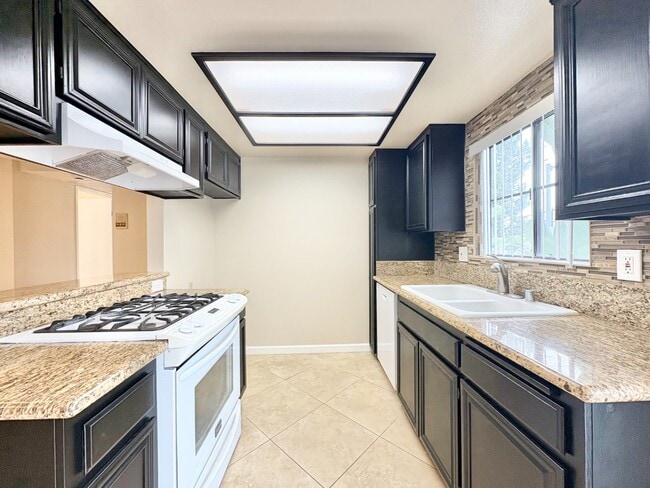 Building Photo - Modern 2BR/2BA Condo with A/C & 2 Parking Spaces – Prime Van Nuys Location