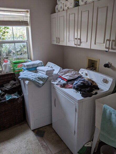 Laundry room with washer and dryer that come with the rental. - 6424 Saint Josephs Ave NW