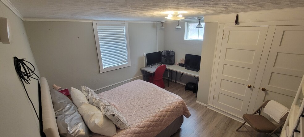 Lower level bedroom with closets. - 814 Atchison Ave