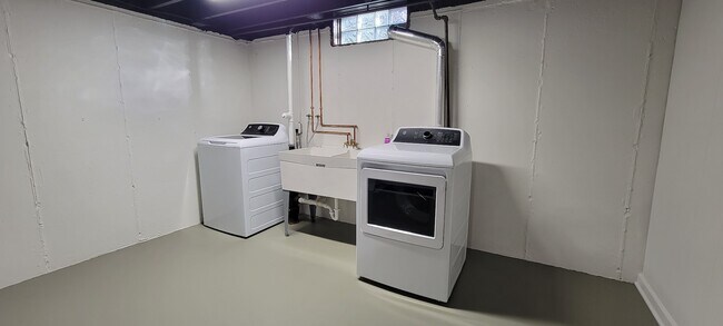 Freshly painted laundry room with brand new washer and dryer, new copper piping, new laundry tub & n - 6305 49th Ave