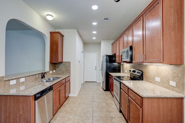 Building Photo - Bright & Roomy 4BR • 2.5BA • Two-Level Living