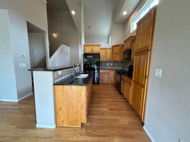 Building Photo - $500 Off First Month Of Rent! Modern 3BR Townhome with Fenced Yard & Garage