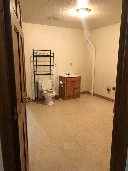 Basement 1/2 bath with laundry - 3015 Harmony Ln