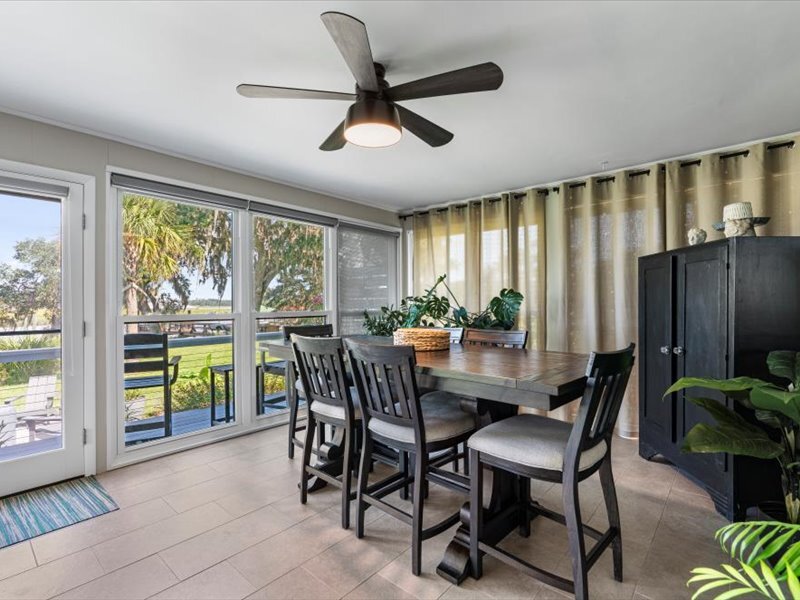 Back room with dining room overlooking marsh - 1868 Tickton Hall Rd