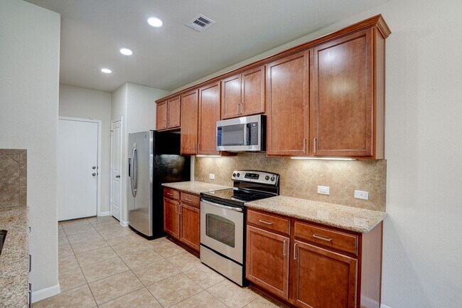 Building Photo - Bright & Roomy 4BR • 2.5BA • Two-Level Living