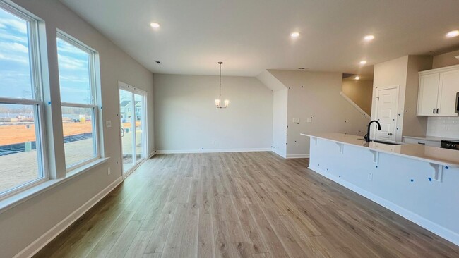 Building Photo - BRAND NEW & Beautiful Townhome with 2 car ...