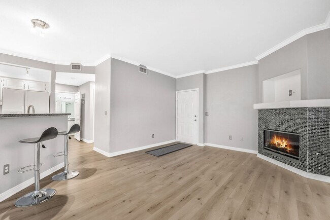 Building Photo - Light-Filled Dual-Suite Condo with Soaring Ceilings, Fireplace & Private Balcony in Amenity-Rich ...