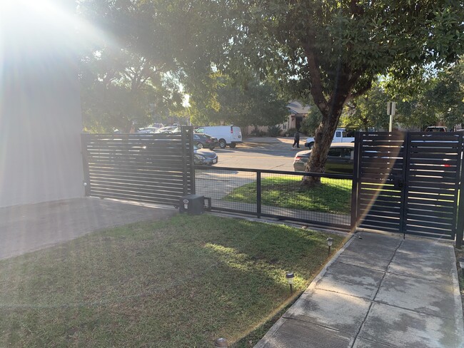 electric gate entrance to rear parking - 1618 Hauser Boulevard