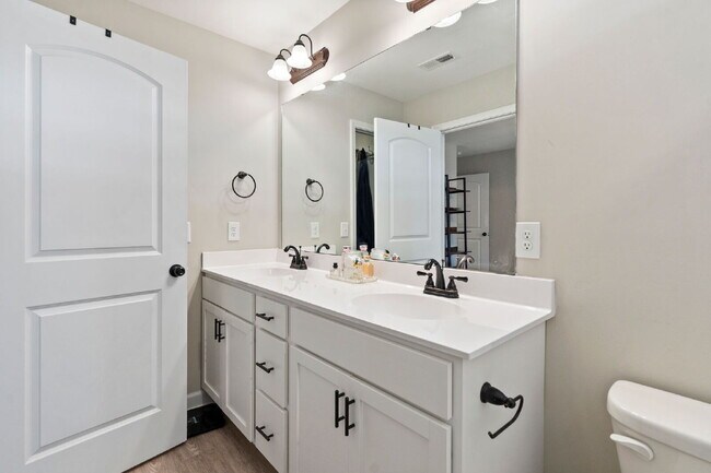 Building Photo - Available Now! Enjoy low-maintenance coastal living in this beautiful 2-bedroom, 2.5-bath townhom...