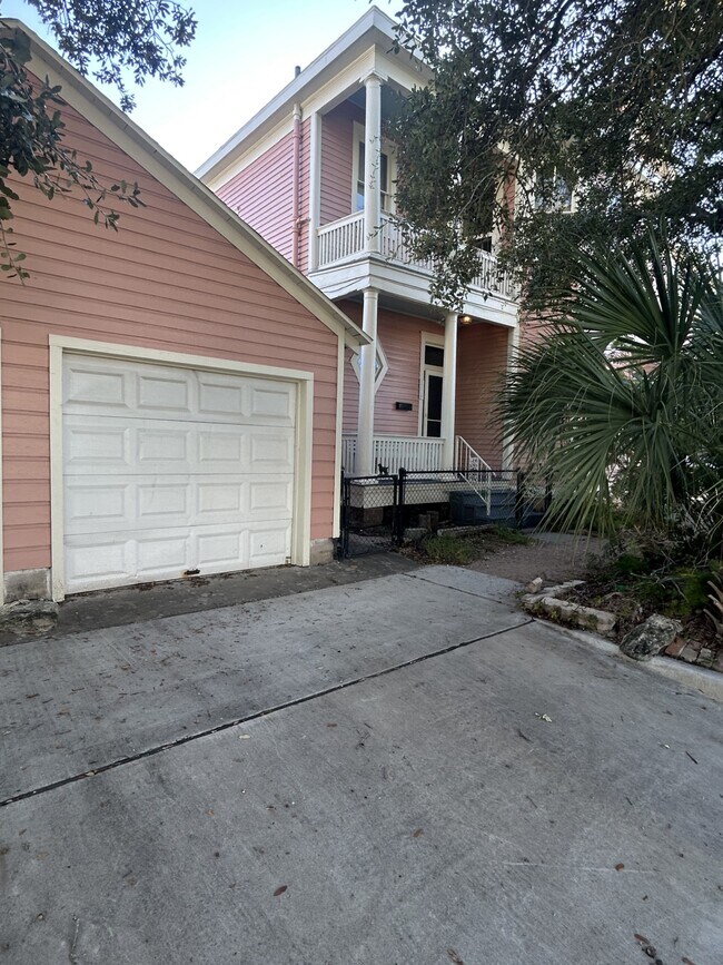 Garage in the foreground comes with the apartment. There is a garage door opener. - 1118 25th St