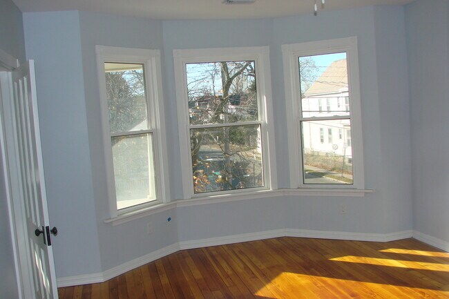 Living room facing street with hallway door - 713 Orchard St