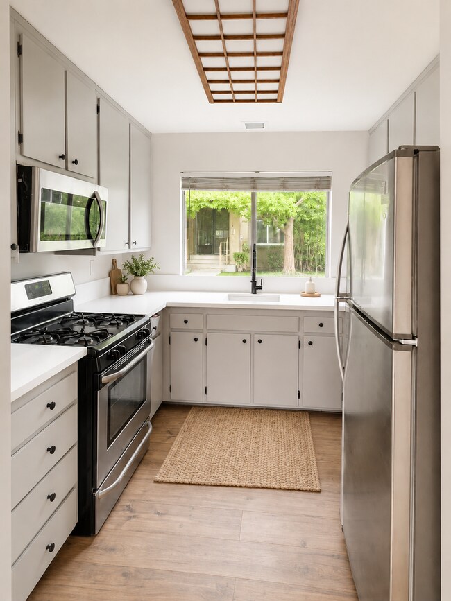 Building Photo - Fully Renovated 3 Bed Townhome with Large Enclosed Patio + 2-Car Garage
