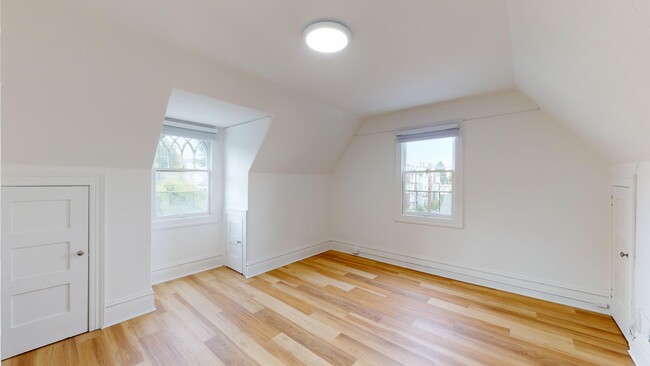 Well-lit room with a floor made of wood, adding a touch of warmth to the room - 2129 Haste Street