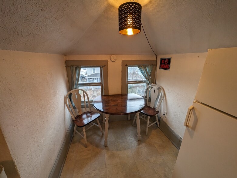 Dining Area, table stays furnished. Can be stored in storage if not wanted. - 3404 Baltimore Ave