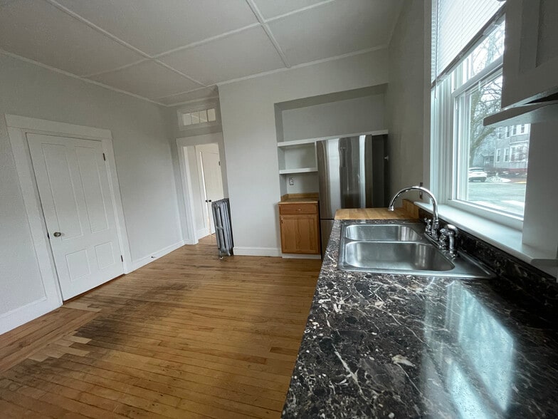 Kitchen w/ stainless steel appliances. - 18 North St