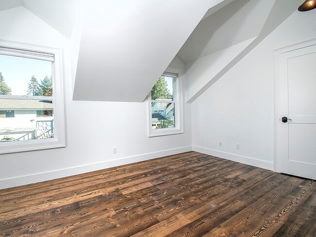 Building Photo - Expansive Loft-Style Carriage House in Private Haller Lake Estate