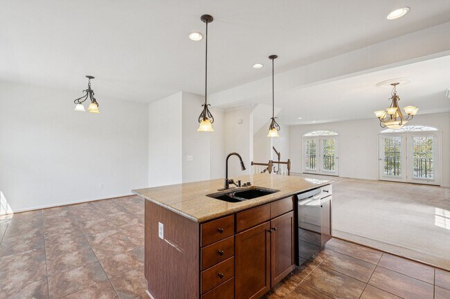 Building Photo - This beautifully maintained end-unit brick...