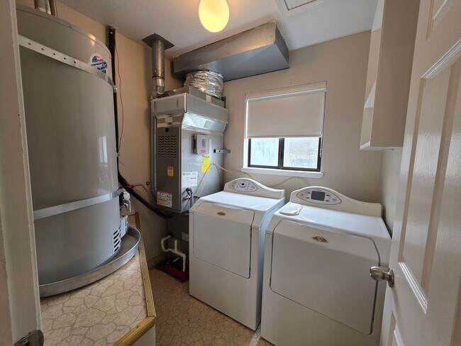Building Photo - Spacious 2BR Condo with Central A/C, Bonus Room & Huge Storage – Walk to Burlingame Avenue