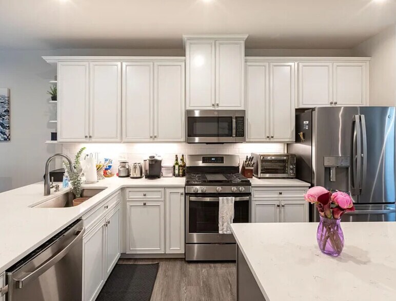 Gorgeous workable kitchen. Bright, upgraded, and open to living and dining areas. - 314 Music Hall Way